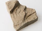 a rock that is sitting on a white surface