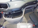 a picture of a car dashboard with a remote control in it