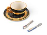 a cup and saucer with a spoon on a saucer