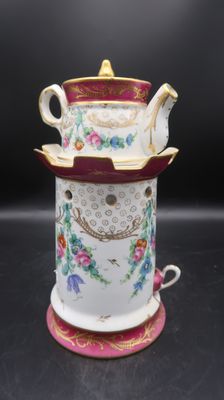 a close up of a cup and saucer on a table