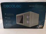 an open box of a microwave sitting on top of a table