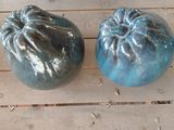 three different colored pumpkins sitting on a wooden table