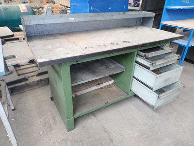 a workbench with drawers and drawers on it in a warehouse