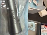 a silver toothbrush in a plastic bag in a store
