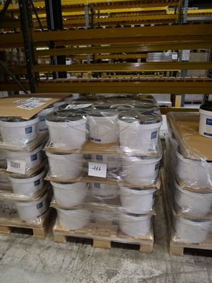 a pallet full of boxes of toilet paper in a warehouse