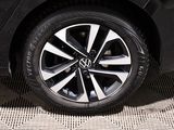 a close up of a car ' s wheel on the ground
