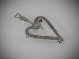 sterling silver heart shaped pendant with a small heart on the side