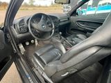 a car that has its door open on the side of the road