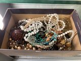 a box full of jewelry sitting on a table