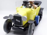 a yellow toy car with a man in a hat driving it