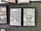a lot of stamps on the floor next to a person ' s feet