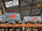 many bags of food sitting on a shelf in a warehouse