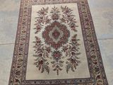 a rug on the floor in the middle of a room