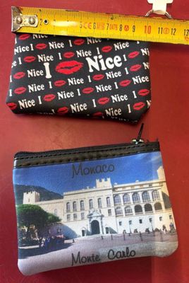 two purses that are sitting next to each other