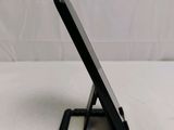 a cell phone that is sitting on top of a stand
