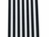 a close up of a black and white striped table cloth