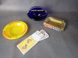 a yellow plate, a blue bowl, and some other items on a table