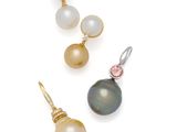 three pairs of pearl and gold earrings on a white background