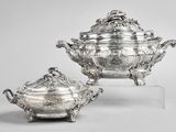 a pair of silverplated dishes and covers on stands