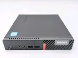 a close up of a small black computer on a white surface