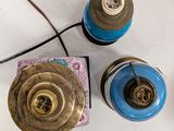 three lamps that are sitting on a white table