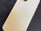 the back of an iphone 11 on a black surface