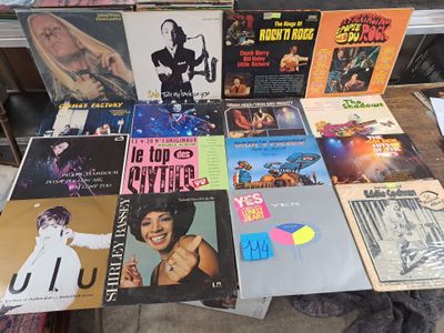 a lot of records on a table in a store
