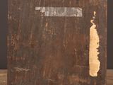 a close up of an old wooden box on a table