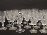 a lot of wine glasses sitting on a table