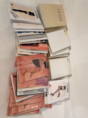 a lot of books that are stacked on top of each other