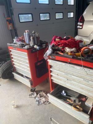two cars that are parked in a garage