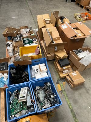 many boxes of electronic equipment on the floor