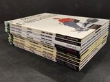 books stacked on top of each other on a black surface