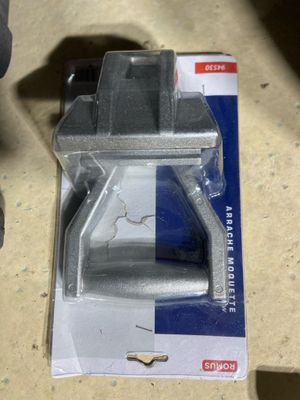 a box with a piece of metal in it