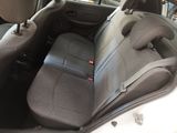 the back seats of a car with a seat belt in the back of it