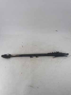 a black pen sitting on top of a white surface