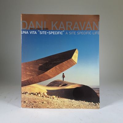 the cover of a book with a person standing on a hill