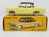 yellow toy car sitting on top of a yellow box with a surfboard on top of it