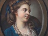 portrait of a woman in a blue dress with a blue headband