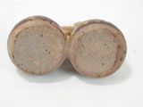 pair of antique stoneware vases on white surface with white background