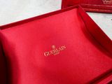 a red box with a gold logo on it and a red box with a gold logo on it