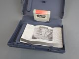 a blue case with a book inside of it on a table