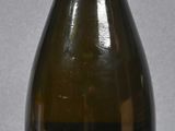 a bottle of wine that is sitting on a table