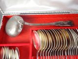 a red box with silverware in it and a spoon and fork in it
