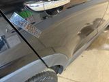 a close up of a car door handle with a sticker on it