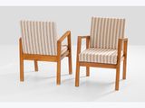 two wooden chairs with striped upholstered cushions in a white room