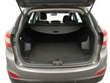 the back of a car with the trunk open and the seats down