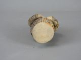 a close up of a cork stopper on a table