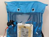 a blue bag with a picture on it sitting on a table