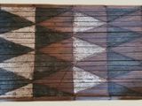 a piece of wood that has been painted with different colors